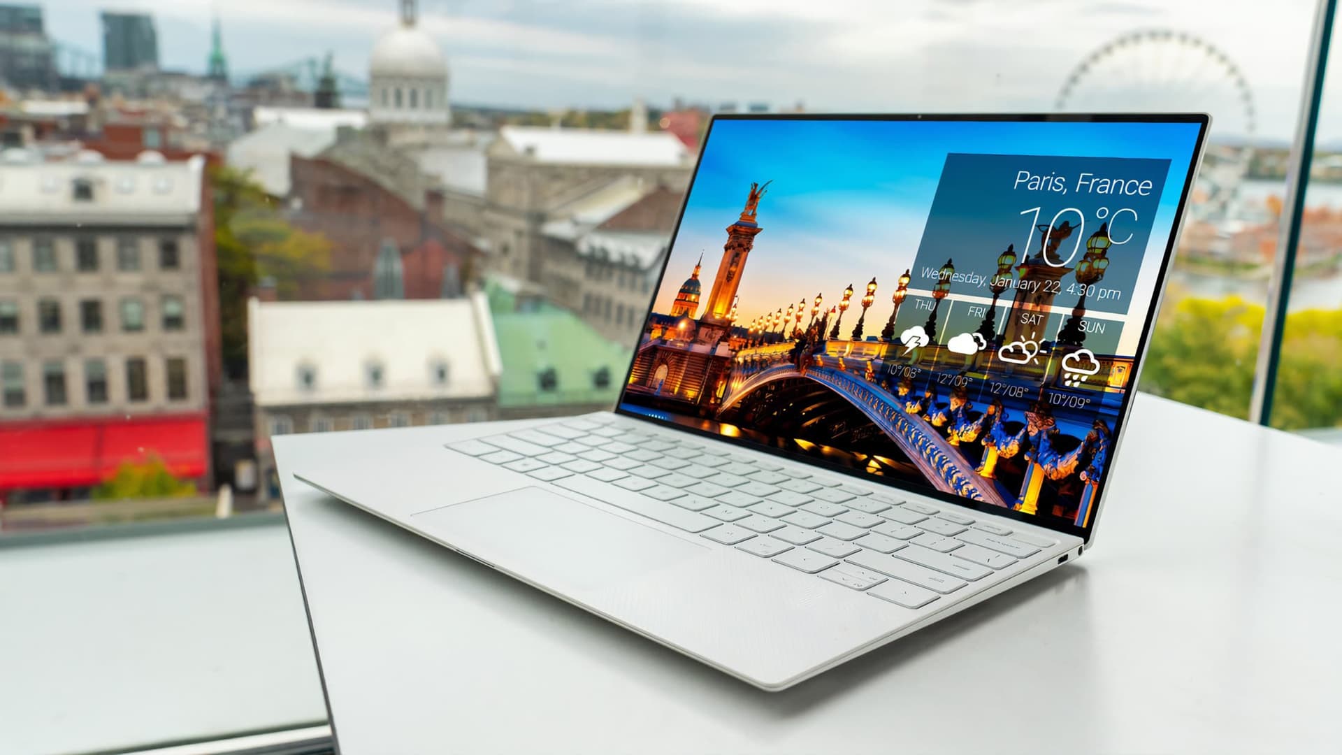 A laptop with white keyboard